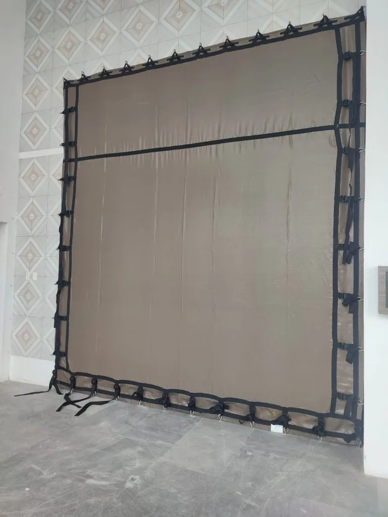 Taupe hurricane screens on high-rise terrace