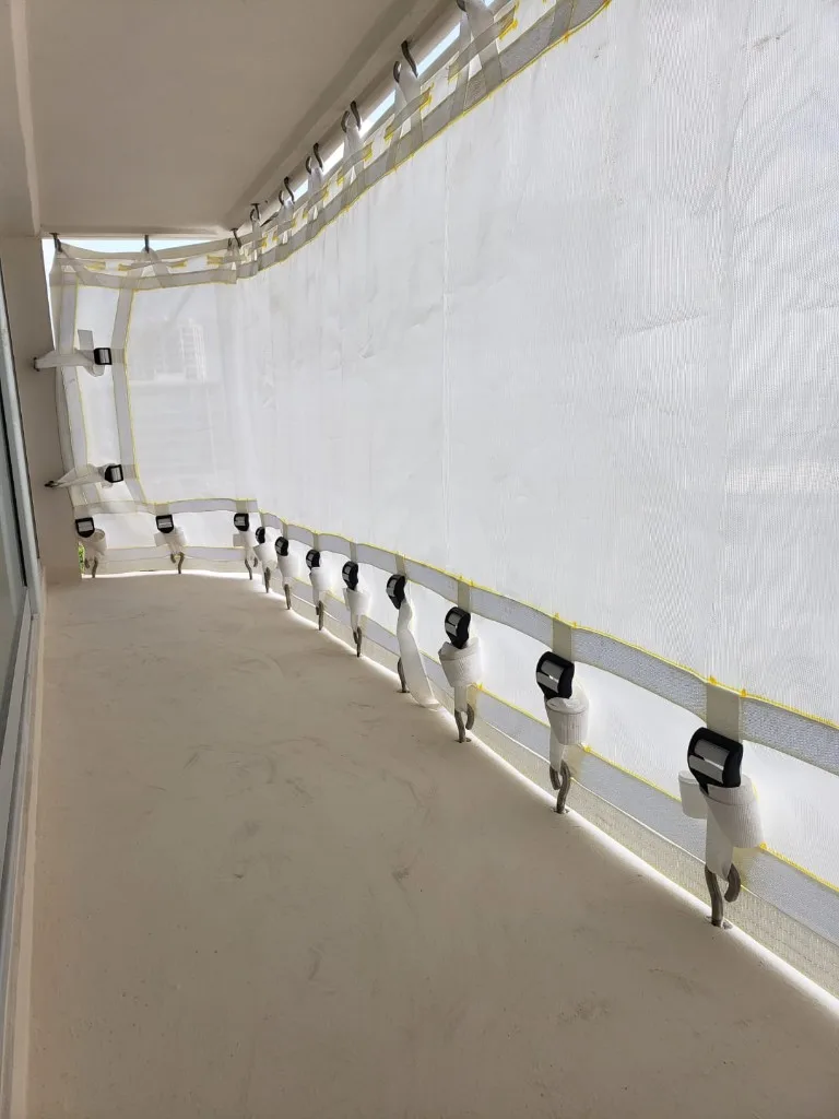 Clear corrugated storm panels under pergola