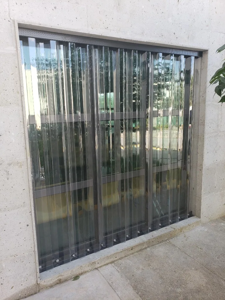 Transparent polycarbonate panels on stone facade