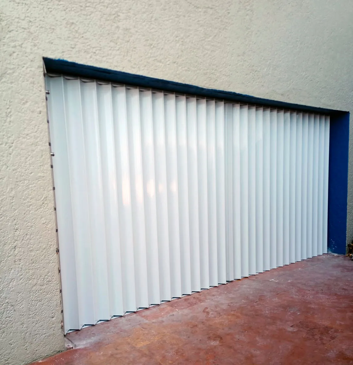 Dark accordion hurricane shutters